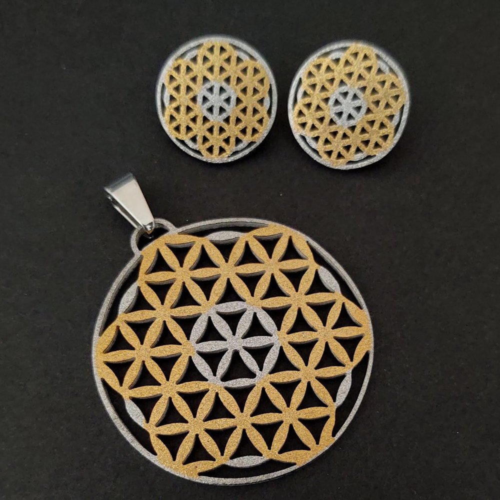 Shimmery gold and silver stainless steel pendant and earring set